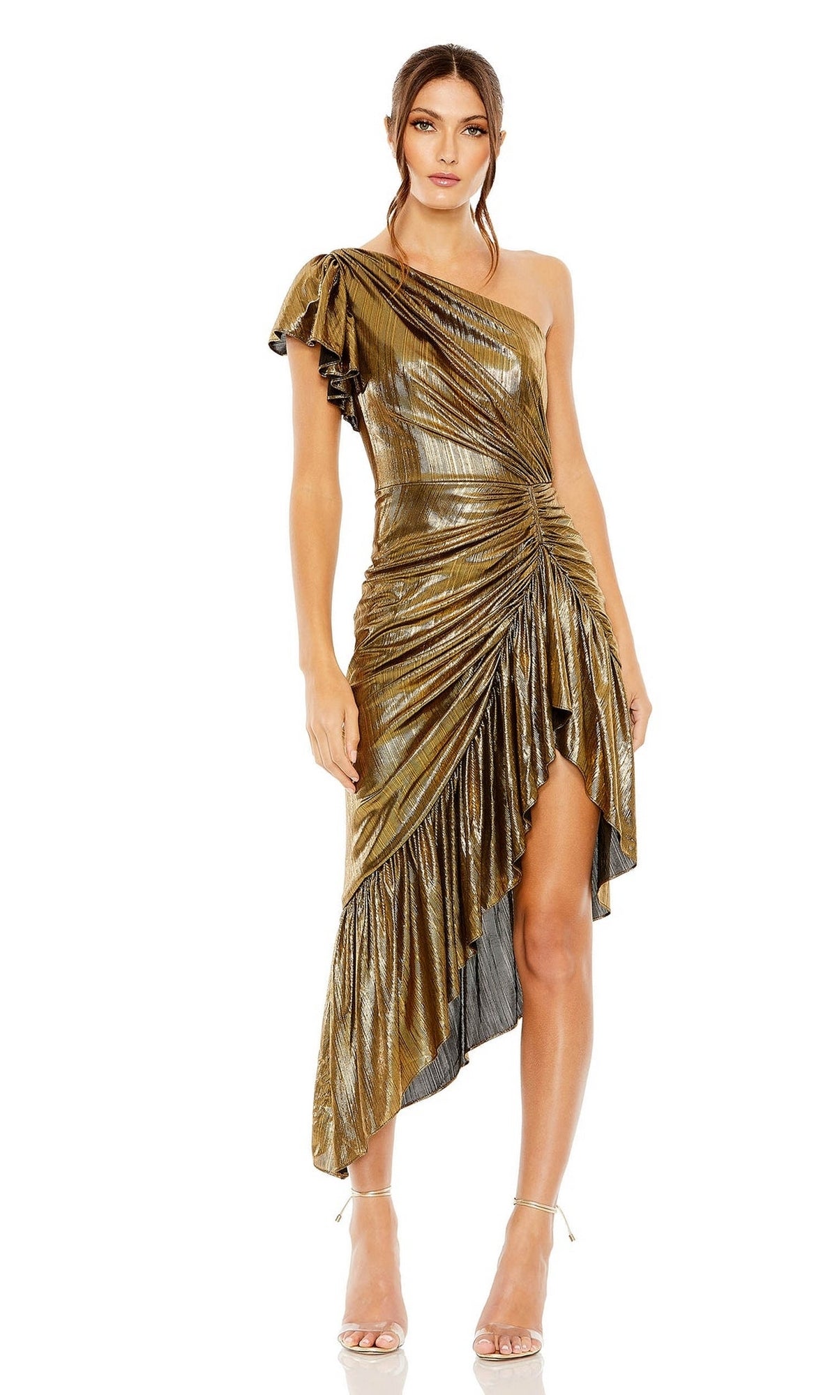A woman wearing the Mac Duggal Short Wedding Guest Dress 27075, a metallic asymmetric one-shoulder dress with ruched details and high-low hem, paired with strappy heels.